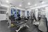 Modern exercise facility with state-of-the-art gym equipment, bright and spacious layout, and inviting decor.