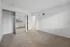 Bright and airy bedroom with plush carpet, large mirrored closet, and ample natural light through a window.