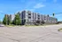 Contemporary apartment complex showcasing modern architecture with spacious balconies, lush landscaping, and a vibrant urban setting.