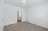 Bright, inviting room with plush carpet and a softly lit ambiance, ideal for creative decor touches and cozy relaxation.