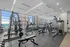 Bright and modern fitness center equipped with state-of-the-art gym equipment and expansive city views.