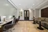 Modern and inviting workspace featuring plush chairs, sleek tables, and contemporary lighting in a stylish office setting.