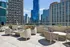 Stunning rooftop terrace with modern seating and breathtaking skyline views, perfect for urban relaxation.