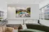 Luxurious modern living space with stunning city views, chic furniture, and a warm fireplace creating a cozy atmosphere.
