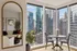 Elegant city apartment with panoramic views, featuring a stylish dining nook, modern decor, and abundant natural light.