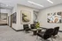 Elegant apartment lobby with contemporary art, plush seating, and stylish décor creating a welcoming atmosphere.
