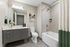 Modern bathroom oasis with sleek vanity, elegant tile work, and designer accents, perfect for relaxation and style.