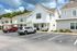 Charming modern townhouses with spacious front porches, set in a peaceful neighborhood with convenient parking.