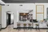 Modern kitchen with sleek breakfast bar, stylish bar stools, stainless steel appliances, and elegant decor accents.