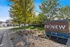 Charming community entrance at ReNew Jordan Creek, showcasing lush landscaping and welcoming signage.
