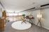 Chic loft office space with natural light, cozy carpet, modern furniture, and elegant decor, perfect for remote work.