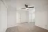 Bright and airy bedroom with plush carpet flooring, modern ceiling fan, and ample closet space.