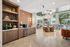 Stylish community space featuring modern decor, cozy seating, and a vibrant mosaic wall, perfect for relaxation and socializing.