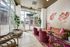 Chic and inviting lobby with modern seating, vibrant artwork, and large windows offering a bright, welcoming atmosphere.