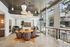 Chic apartment lobby with modern lighting, cozy seating area, and large windows offering abundant natural light.