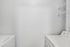 Bright and efficient laundry room featuring modern appliances and ample shelving space.