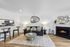 Inviting living room with a modern fireplace, chic decor, and cozy seating area, perfect for relaxation and warmth.