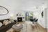 Bright and modern living room with cozy fireplace, stylish decor, and elegant dining area, perfect for entertaining.