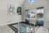 Chic and inviting indoor splash pool area featuring modern art decor and abundant natural light through large windows.