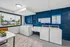 Inviting laundry room with modern washers, dryers, and vibrant decor, offering convenience and style in your apartment living experience.