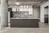 Modern industrial kitchen with sleek cabinetry, stainless steel appliances, and stylish pendant lighting.