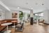 Modern apartment lounge with stylish seating, elegant decor, and abundant natural light.