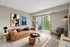 Modern living room with a chic brown sofa, artistic wall decor, and a view of greenery through large sliding doors.