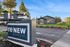 Inviting view of reNEW Avery Park apartments with modern architecture and lush greenery, highlighted by a welcoming leasing office.