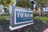 Modern sign for ReNew Avery Park surrounded by lush greenery and vibrant flowers, hinting at a welcoming community environment.