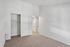 Bright bedroom with plush carpet, spacious closet, and neutral walls offering a blank canvas for personalization.