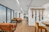 Contemporary lounge area with cozy leather chairs, modern decor, and ample natural light, ideal for relaxation and stylish living.