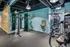 Contemporary gym with state-of-the-art fitness equipment, sleek modern design, and ample space for workouts.