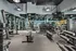 Modern fitness center with state-of-the-art equipment and mirrored walls, offering an optimal workout experience.