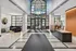 Elegant lobby entrance featuring modern design, welcoming seating area, and a stylish reception desk.