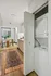 Chic apartment interior featuring a cozy dining area, modern kitchen, and in-unit laundry with stylish decor.