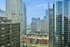 Breathtaking urban skyline with towering modern skyscrapers and serene waterfront views, ideal for city living.