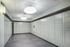 Sleek and modern locker room with sophisticated lighting and ample storage space.