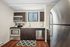 Modern kitchen with stainless steel appliances, elegant dark wood cabinetry, and a bright, welcoming atmosphere.