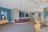 Elegant community lounge with a sleek modern counter, vibrant decor, and natural light, perfect for gatherings.