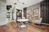 Contemporary apartment lobby with stylish seating area, modern art, and warm wood floors.