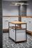 Modern mailroom with stylish geometric flooring, sleek mailboxes, and a chic central recycling station with overhead contemporary lighting.