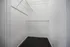 Spacious walk-in closet with sturdy wire shelving, ideal for organized storage.