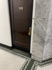 Front Door of Unit featuring Gold Hardware