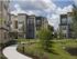 Dwell Nona Place, exterior, landscaping, walkways, three level tan and blue building