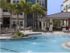 Dwell Nona Place, exterior, sparkling blue swimming pool, cabana