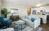 Living room at Seasons at Mount Pleasant Apartments in Mount Pleasant, Wisconsin with open layouts and natural light.