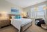 Bedroom at Seasons at Mount Pleasant Apartments in Mount Pleasant, Wisconsin offering functional space for rest and comfort.