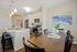 Apartment kitchen at Seasons at Mount Pleasant Apartments in Mount Pleasant, Wisconsin featuring contemporary layouts, cabinetry, and appliances.