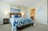 Bedroom at Seasons at Mount Pleasant Apartments in Mount Pleasant, Wisconsin offering functional space for rest and comfort.