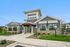 Exterior view of the clubhouse at Seasons at Mount Pleasant Apartments in Mount Pleasant, Wisconsin.